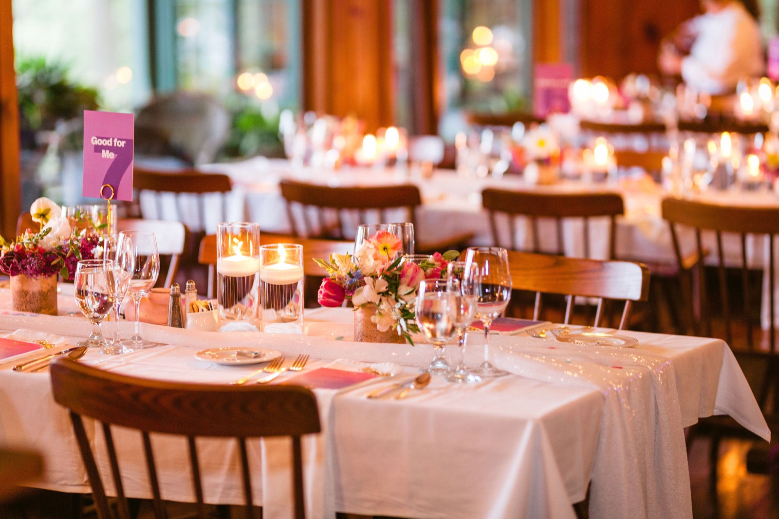 Candlelit reception centerpieces in vivid summer tones