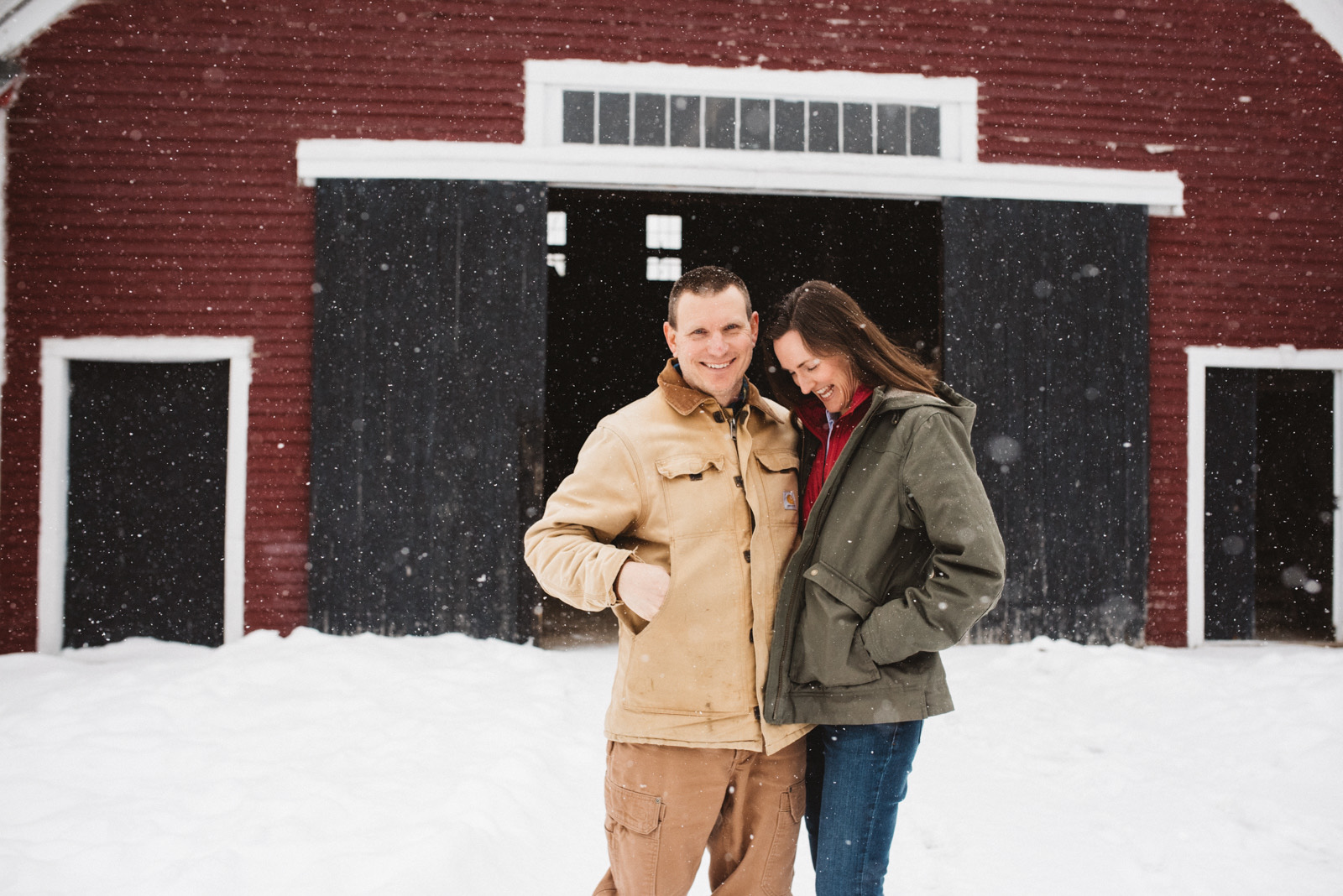 Jennifer and her husband at the barn in winter